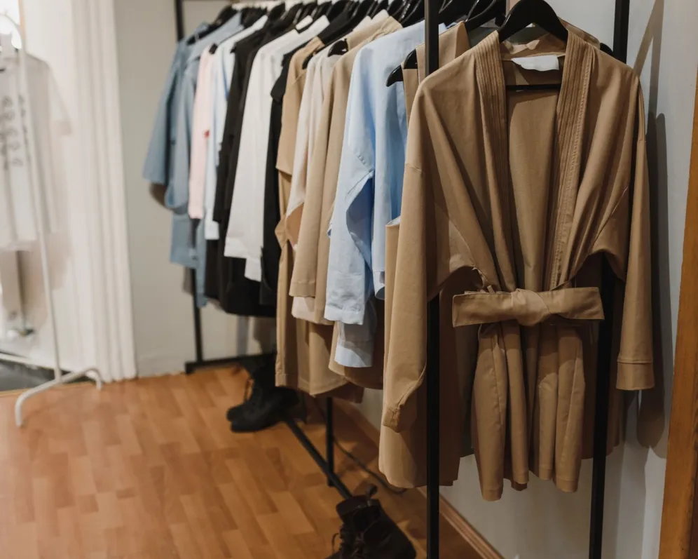 A boutique rail of garments, of the kind sold through a store running on this platform